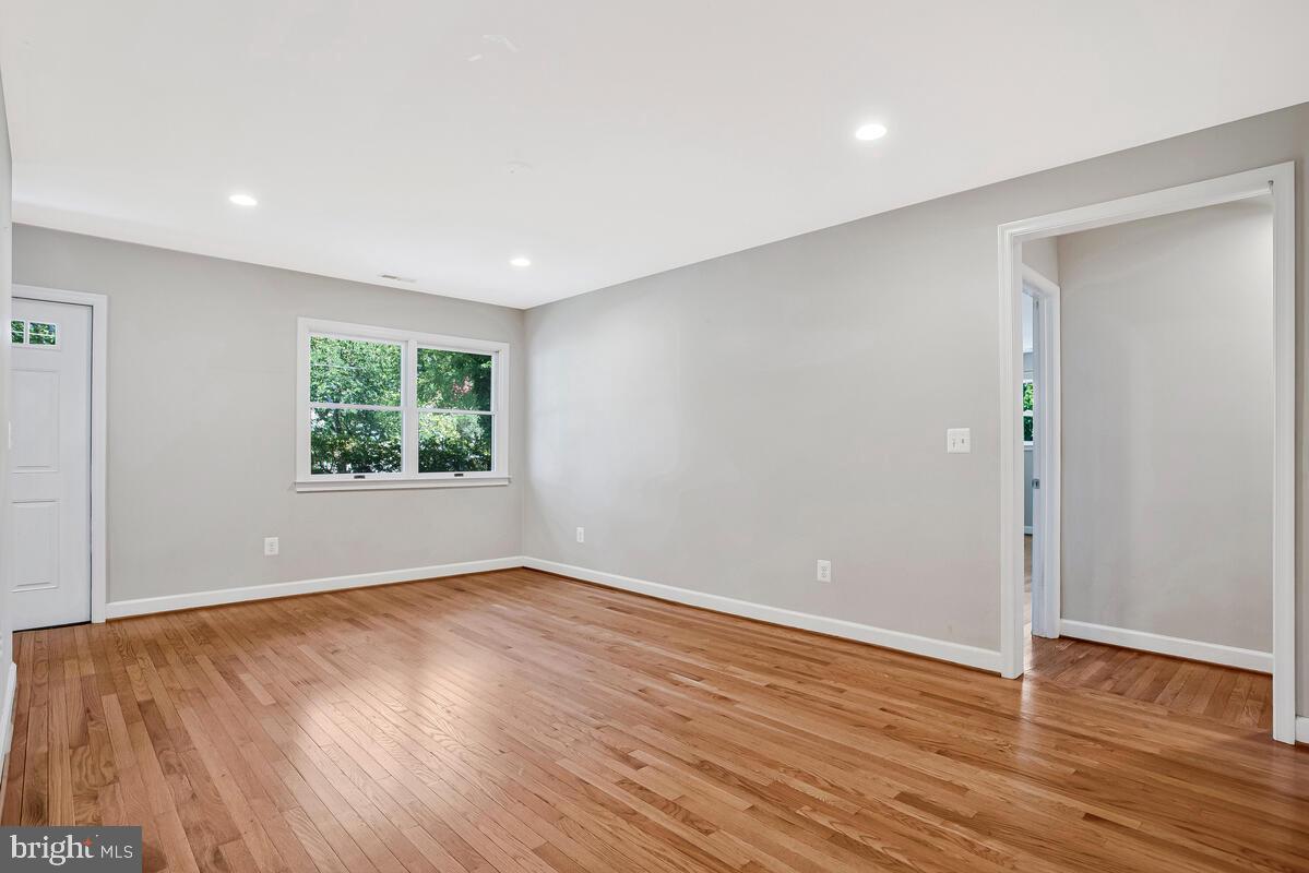 1533 Wakefield Road Edgewater, MD 21037 - Photo 17 of 41 an empty room with wooden floor and window