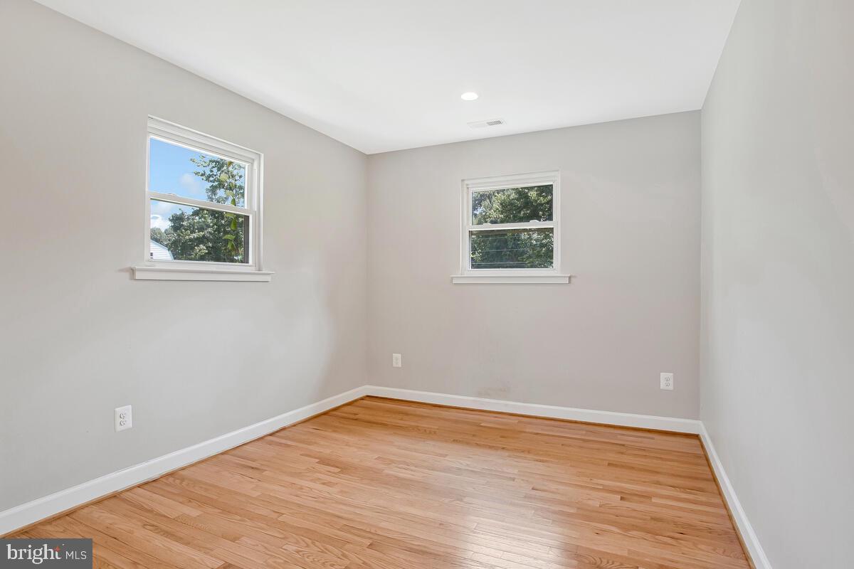 1533 Wakefield Road Edgewater, MD 21037 - Photo 22 of 41 an empty room with wooden floor and window