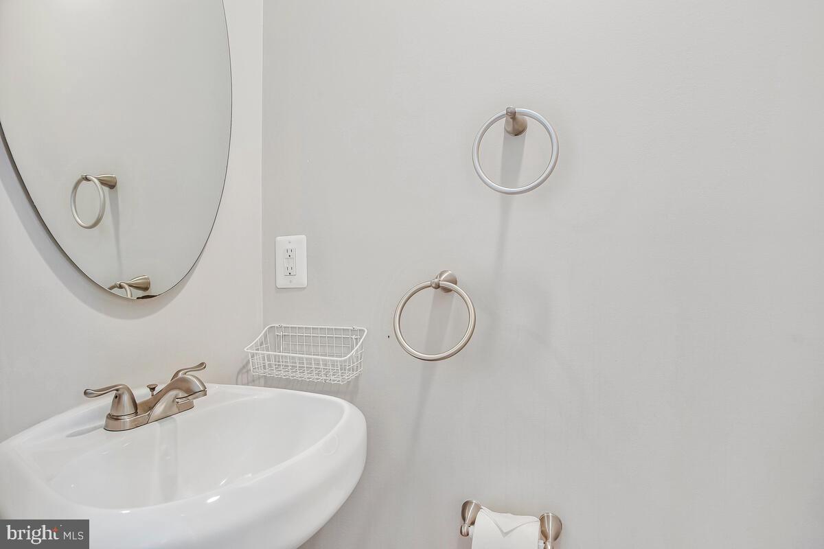 1533 Wakefield Road Edgewater, MD 21037 - Photo 24 of 41 a bathroom with a sink and a mirror