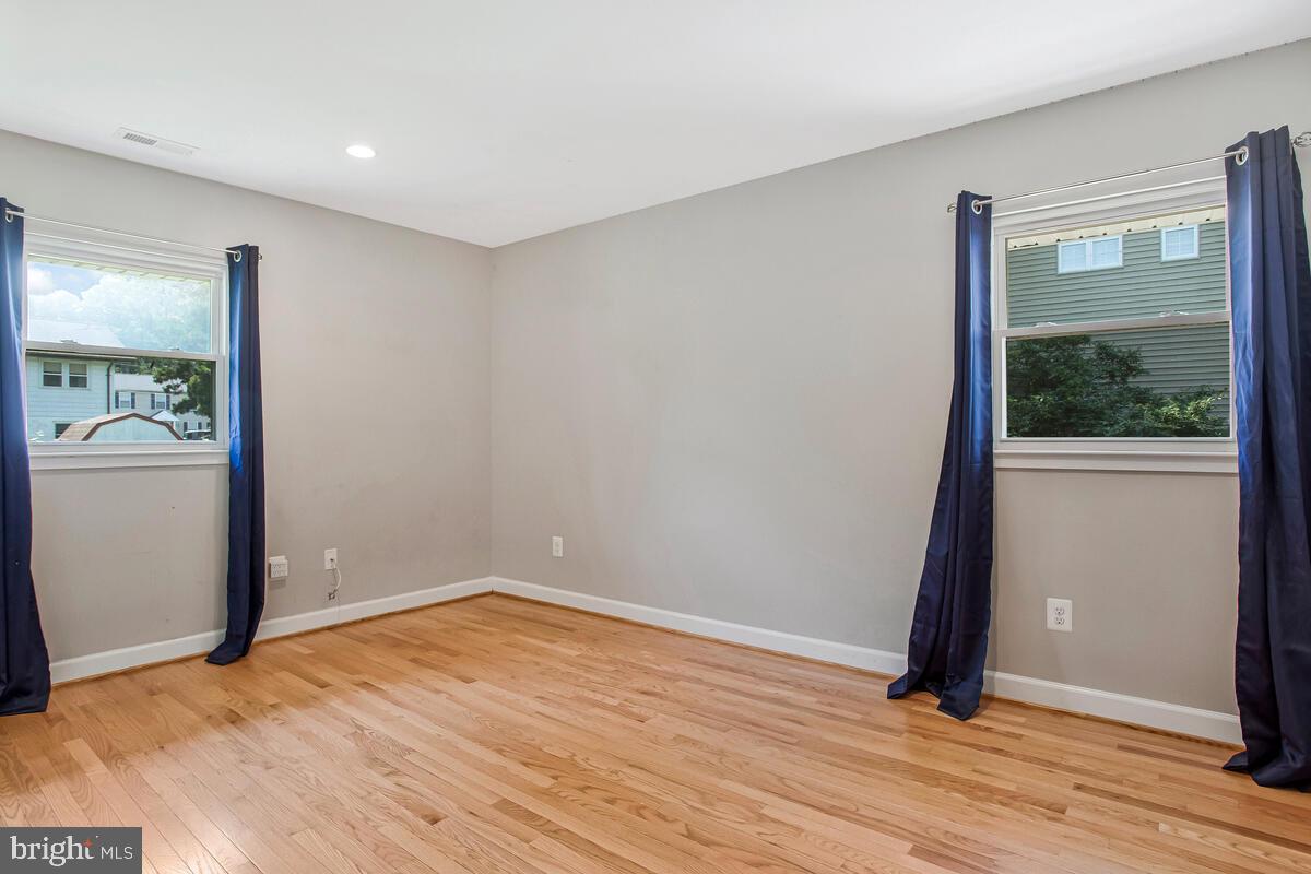 1533 Wakefield Road Edgewater, MD 21037 - Photo 25 of 41 wooden floor in an empty room with a window