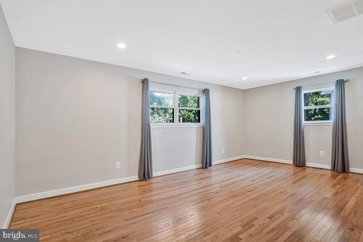 1533 Wakefield Road Edgewater, MD 21037 - Photo 29 of 41 a view of an empty room with wooden floor and window