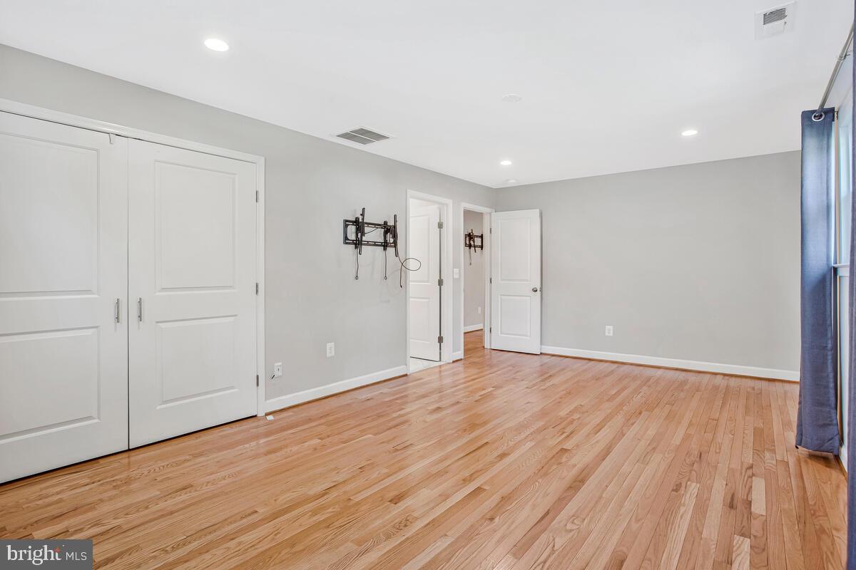 1533 Wakefield Road Edgewater, MD 21037 - Photo 32 of 41 a view of an empty room with wooden floor