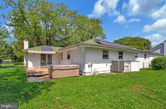 a view of a backyard with a sitting area