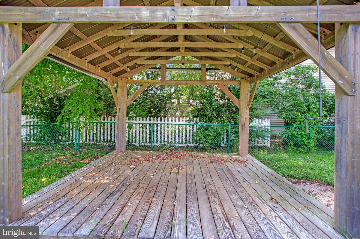 1533 Wakefield Road Edgewater, MD 21037 - Photo 39 of 41 a view of a backyard with wooden floor barbeque and outdoor seating