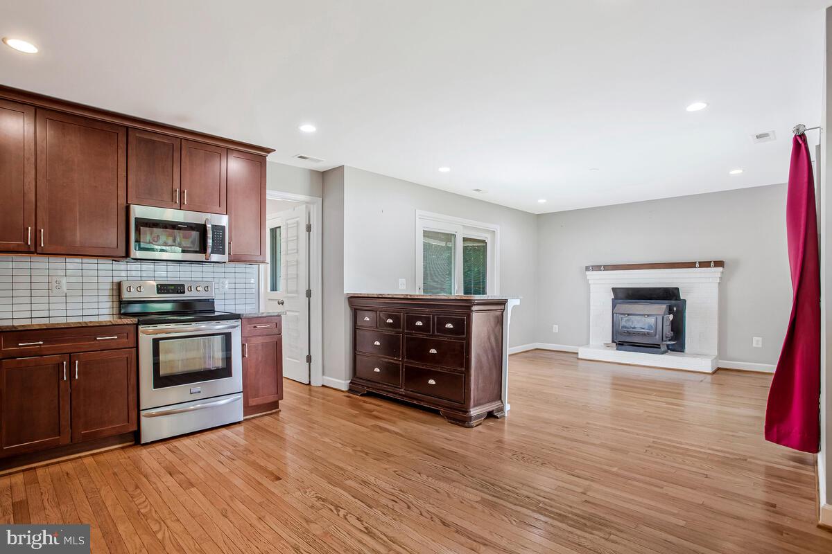 1533 Wakefield Road Edgewater, MD 21037 - Photo 10 of 41 a kitchen with granite countertop a stove top oven and sink