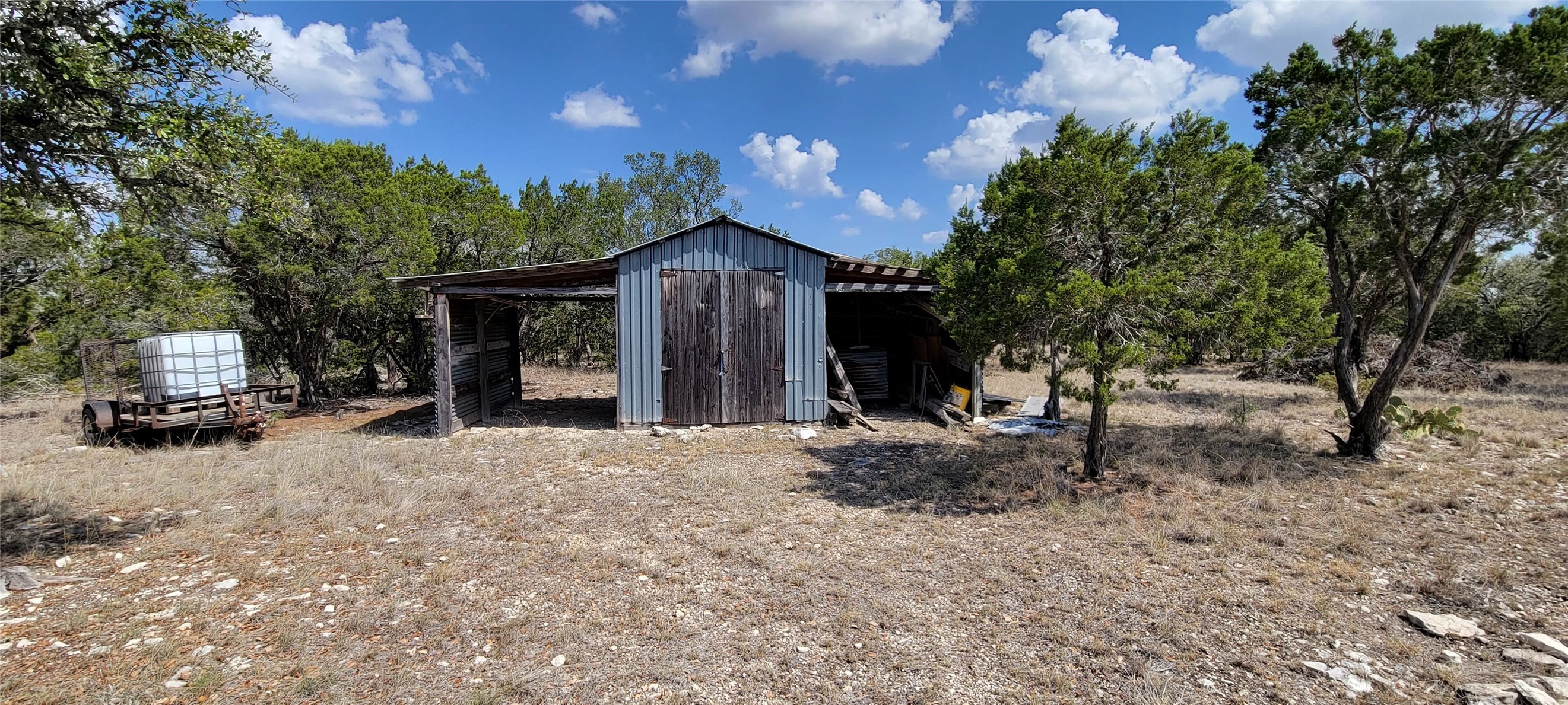 989 Cedar Ridge Road Junction, TX 76849 - Photo 43 of 50 a view of a house with a patio