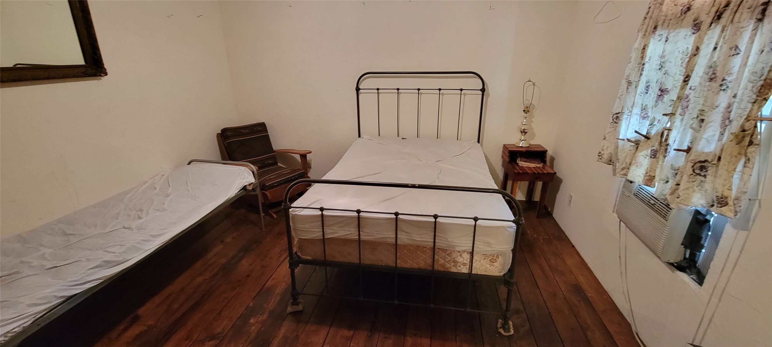 989 Cedar Ridge Road Junction, TX 76849 - Photo 48 of 50 a view of a hallway with furniture and wooden floor