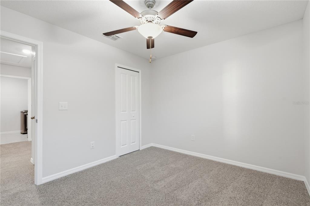 5223 Dandelion Street Apollo Beach, FL 33572 - Photo 12 of 19 an empty room with a ceiling fan and a ceiling fan