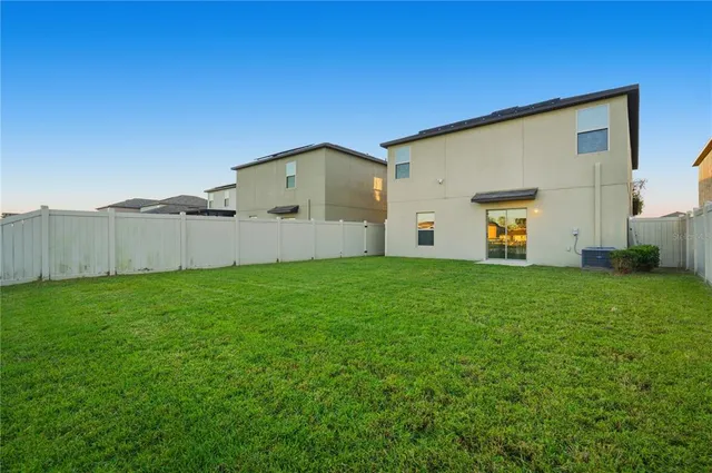 a view of a back yard of the house