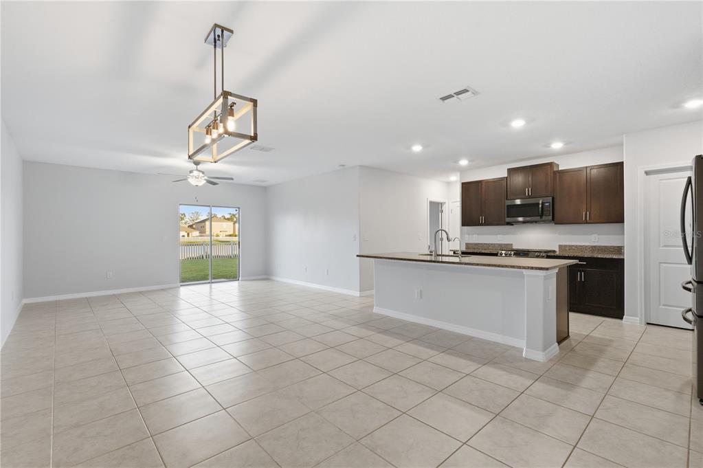 5223 Dandelion Street Apollo Beach, FL 33572 - Photo 2 of 19 a view of a kitchen with a sink and microwave
