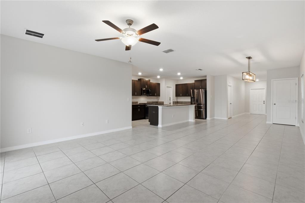 5223 Dandelion Street Apollo Beach, FL 33572 - Photo 4 of 19 an open kitchen with cabinets and stainless steel appliances