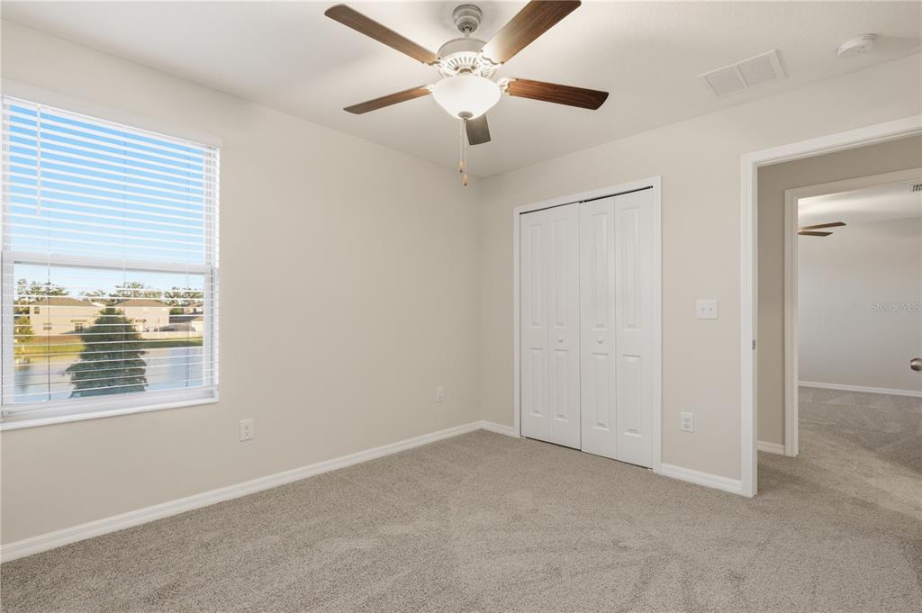 5223 Dandelion Street Apollo Beach, FL 33572 - Photo 10 of 19 an empty room with a window and a ceiling fan