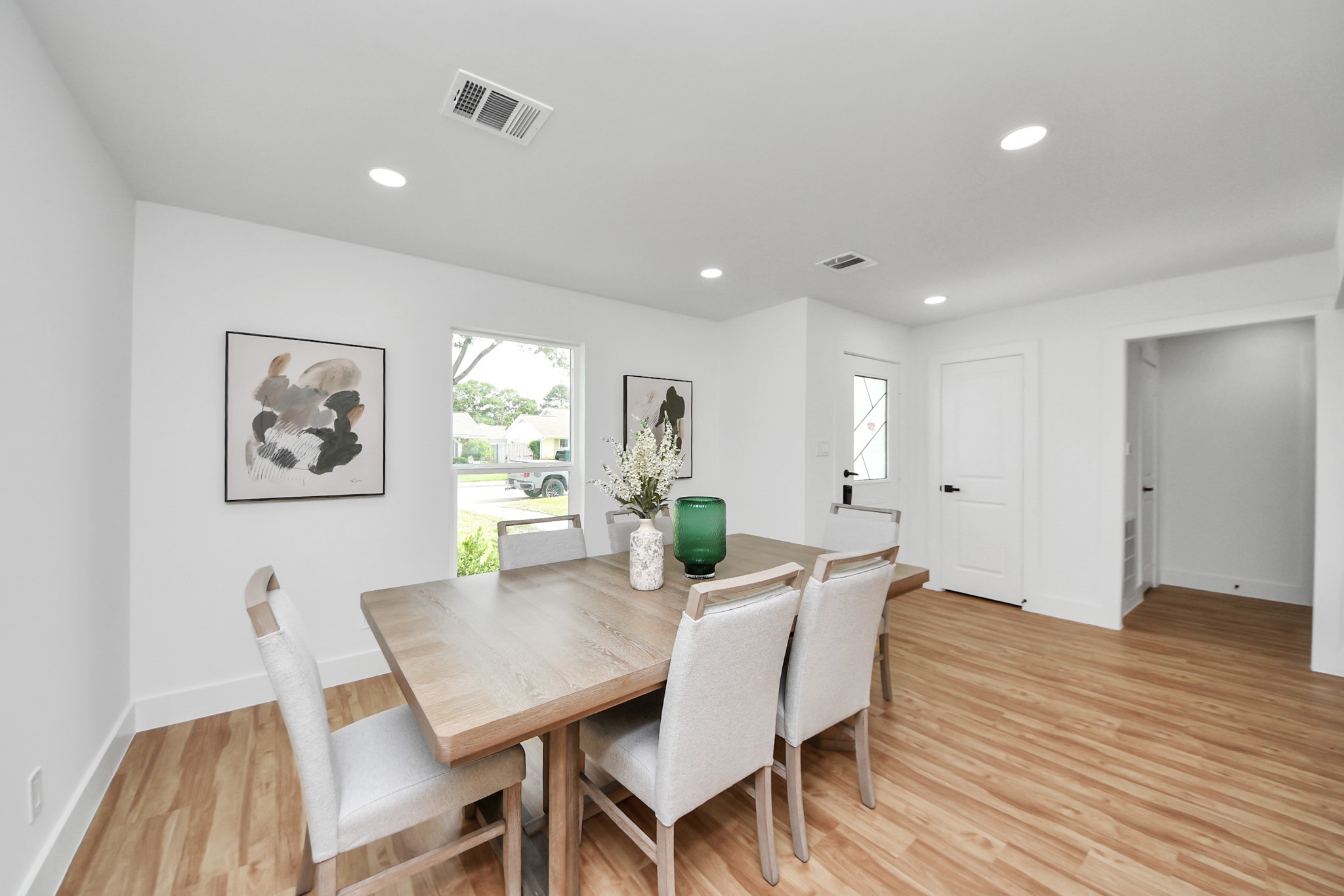 6249 Locke Lane Houston, TX 77057 - Photo 13 of 47 a view of a dining room with furniture window and wooden floor