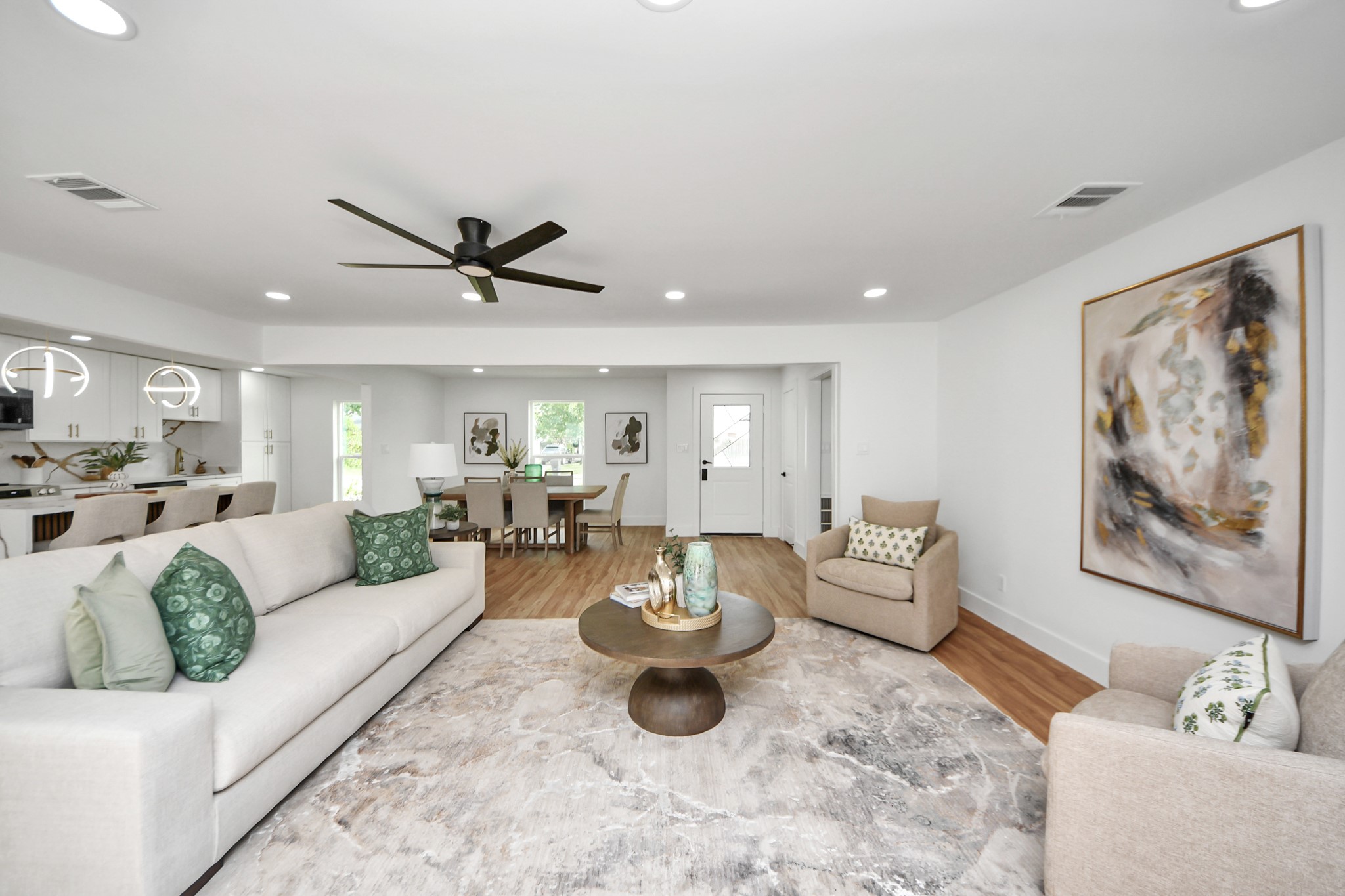 6249 Locke Lane Houston, TX 77057 - Photo 19 of 47 a living room with furniture a rug and a ceiling fan