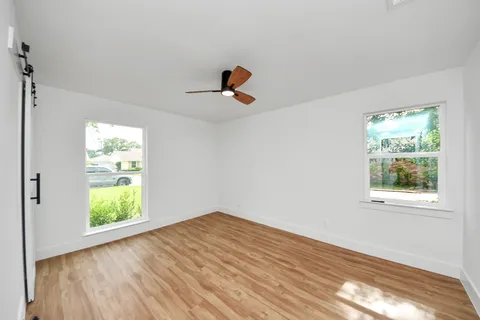 a bed room with a bed and a night stand