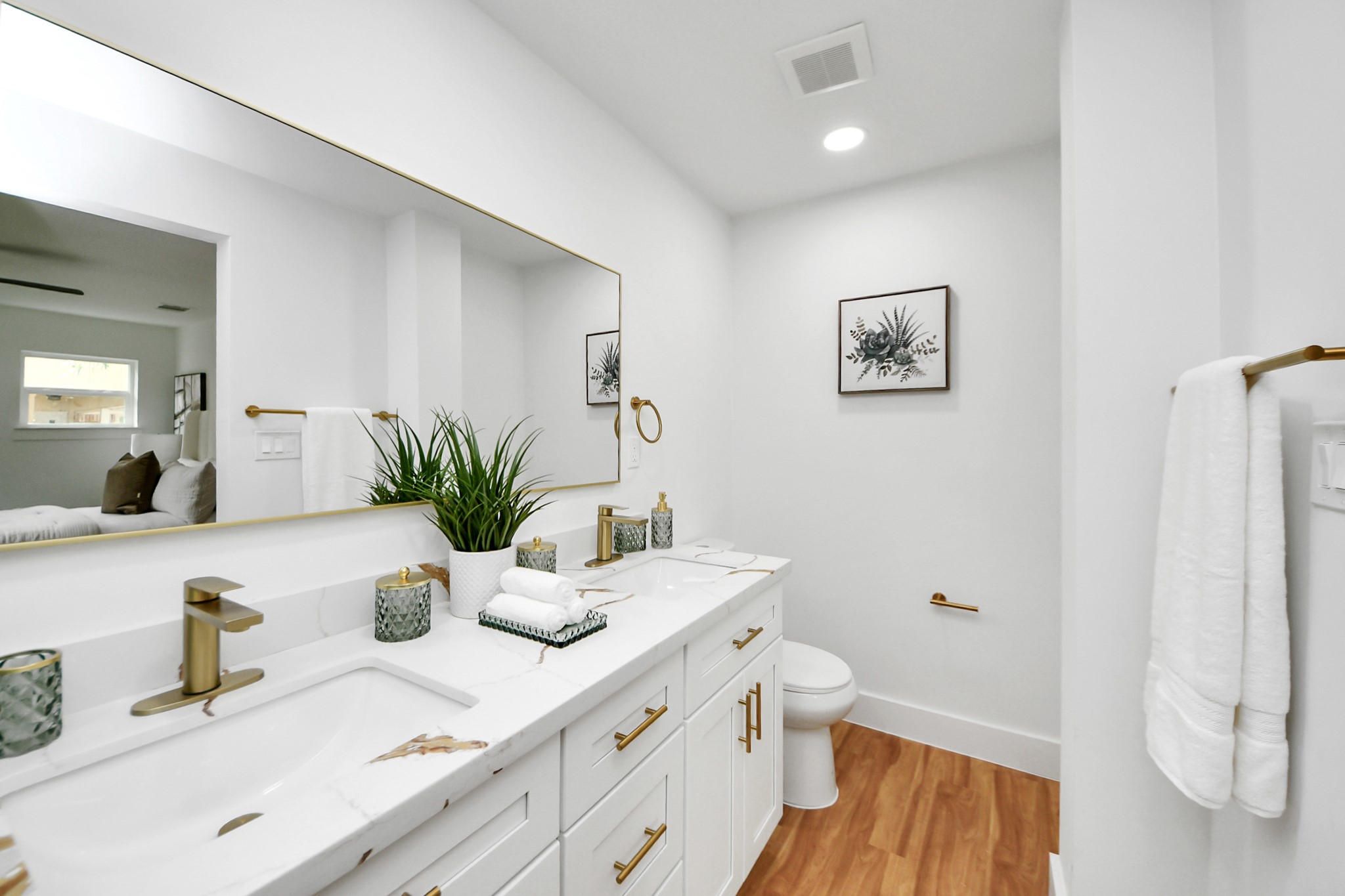 6249 Locke Lane Houston, TX 77057 - Photo 45 of 47 a bathroom with a granite countertop sink mirror vanity and toilet