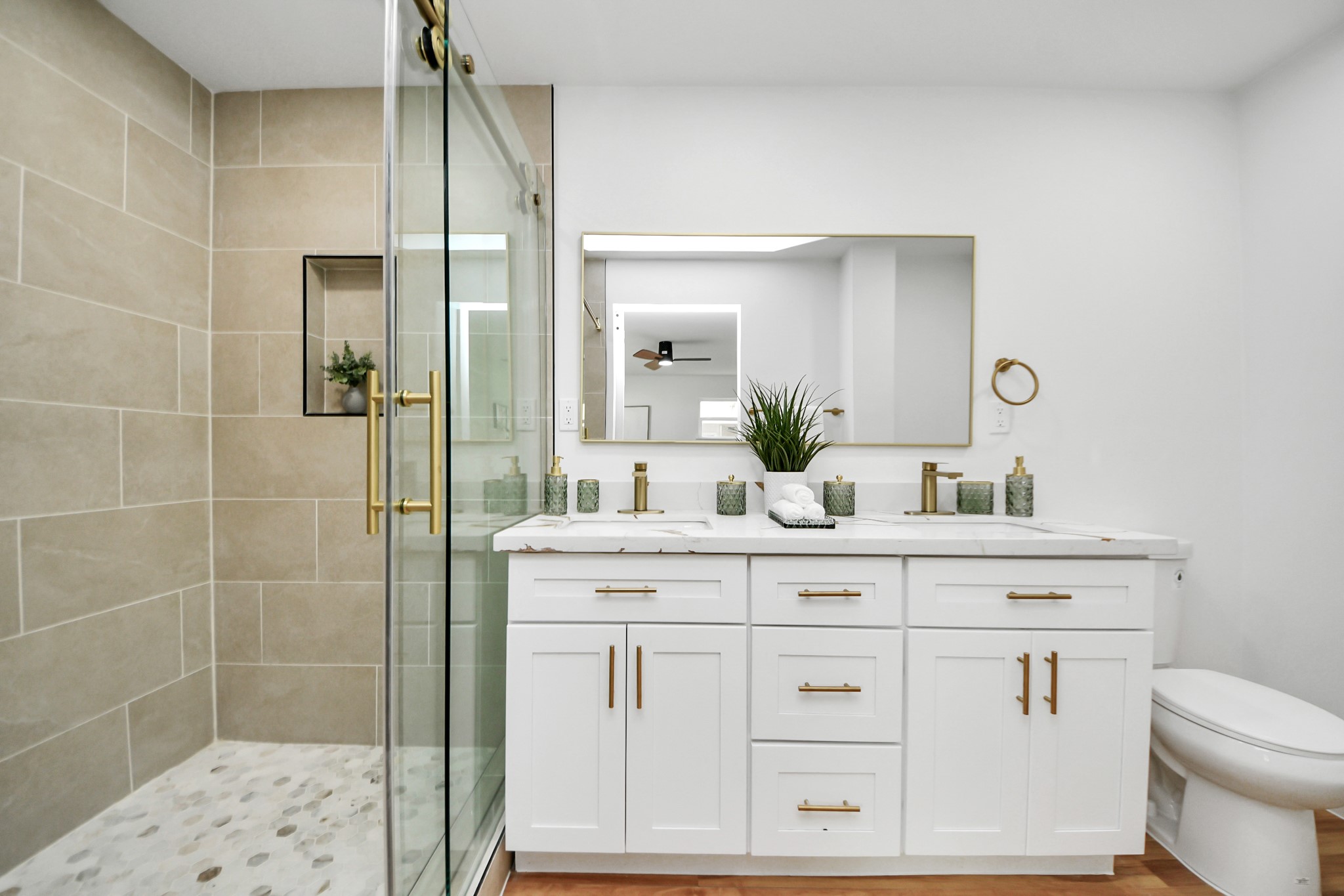 6249 Locke Lane Houston, TX 77057 - Photo 46 of 47 a bathroom with a sink a toilet and shower