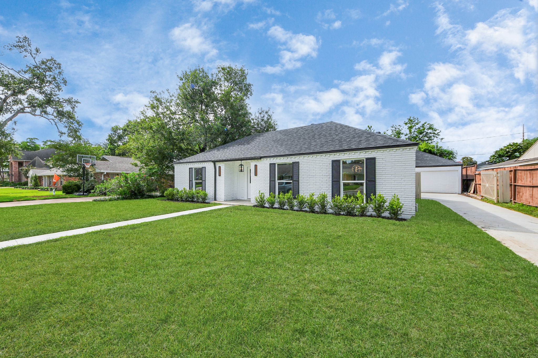 6249 Locke Lane Houston, TX 77057 - Photo 5 of 47 a front view of a house with garden