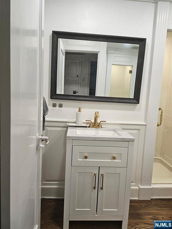 440 Bogert Road River Edge, NJ 07661 - Photo 16 of 25 a bathroom with a sink vanity and a mirror