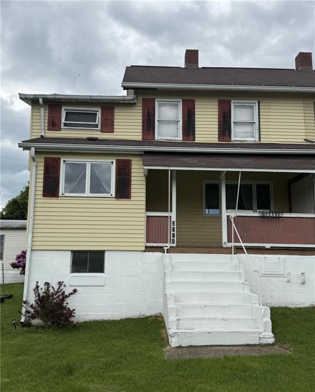 48 2nd Street Dunbar, PA 15431 - Photo 2 of 6 a front view of a house with a yard