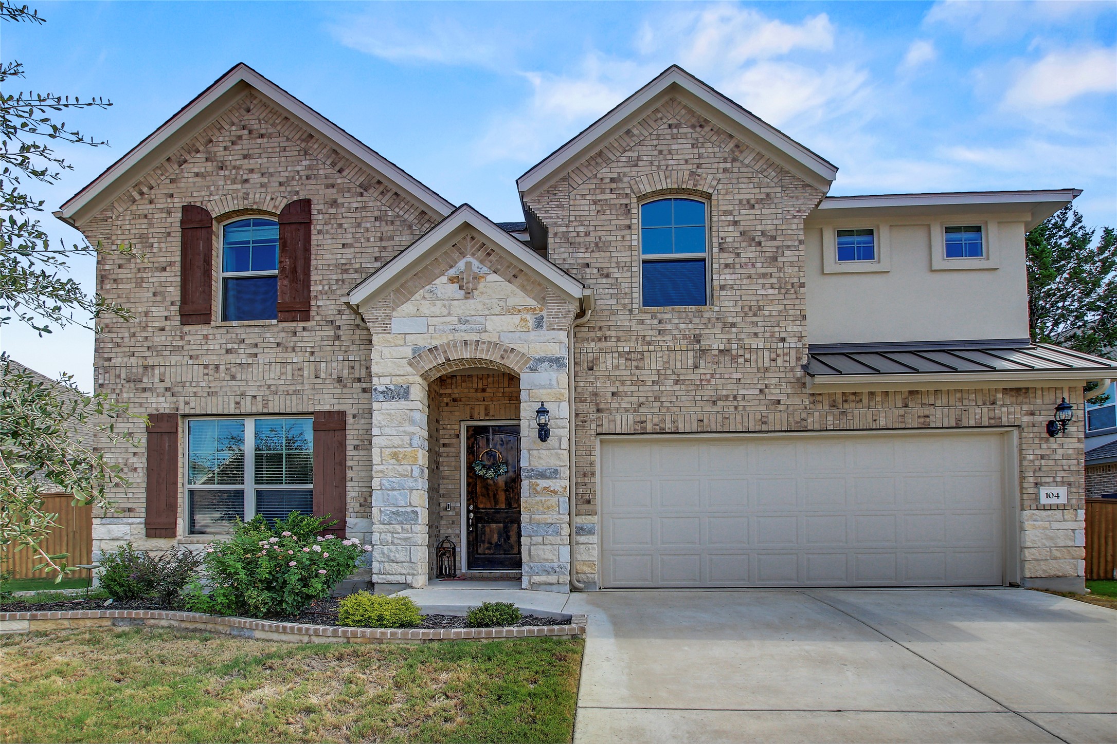 104 Millbend Road Georgetown, TX 78633 - Photo 2 of 40 A charming brick and stone facade welcomes you to this delightful residence.