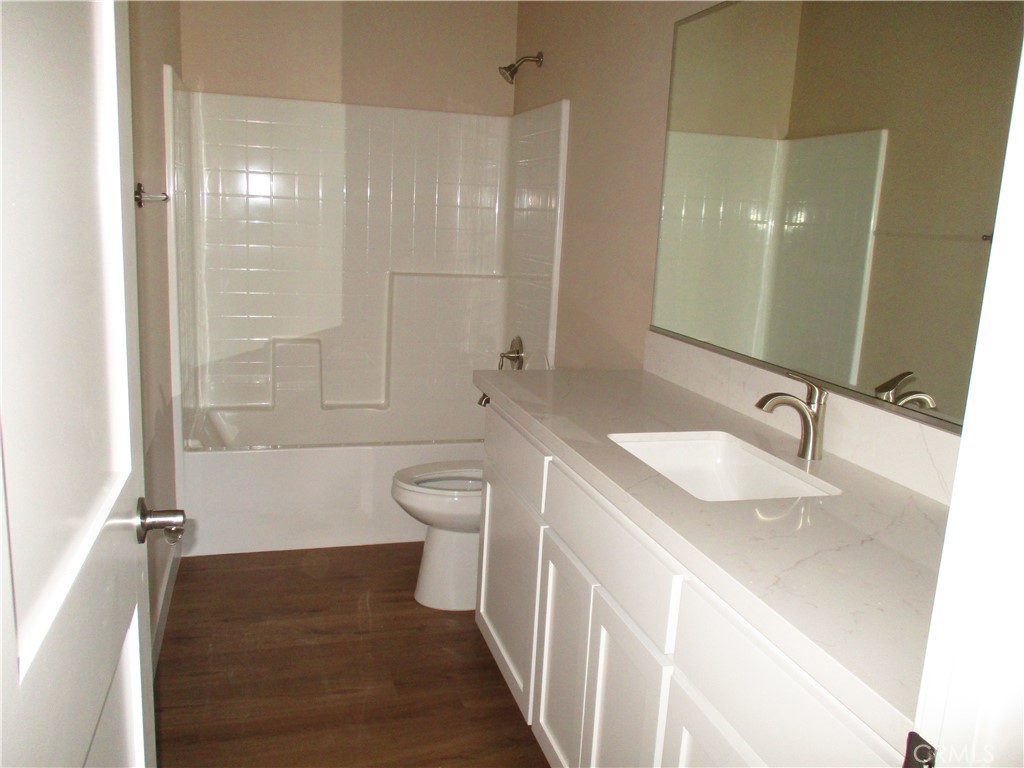 24236 Cahuilla Road Apple Valley, CA 92307 - Photo 18 of 48 a bathroom with a sink and a mirror