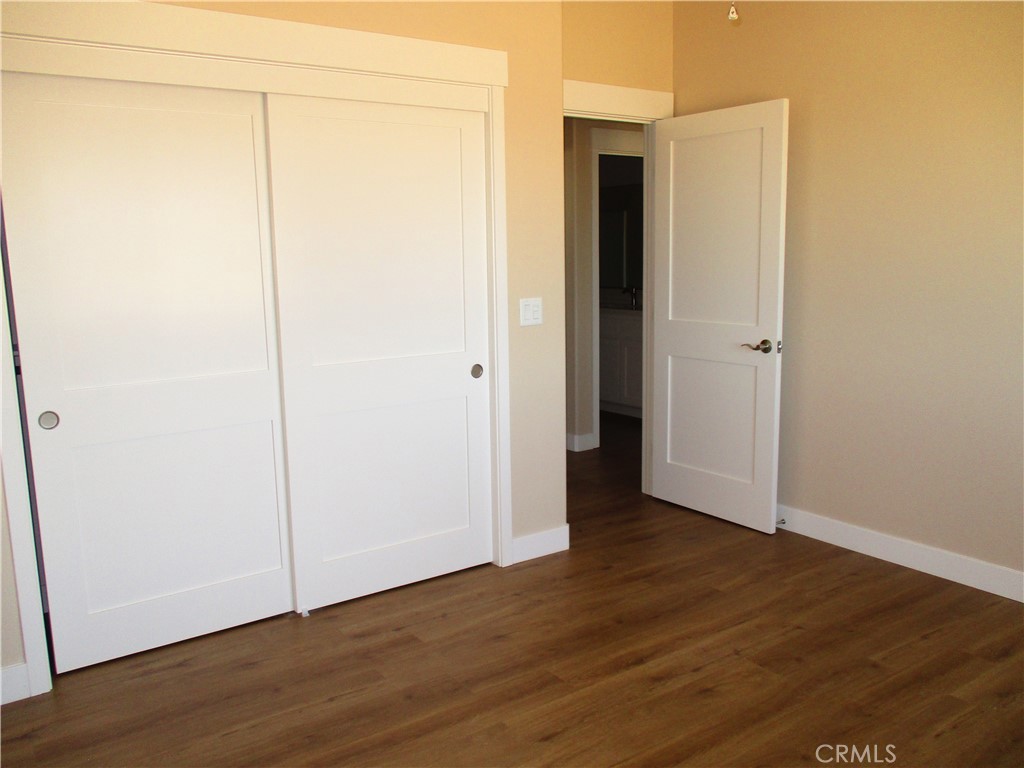 24236 Cahuilla Road Apple Valley, CA 92307 - Photo 19 of 48 a view of a small space with wooden floor