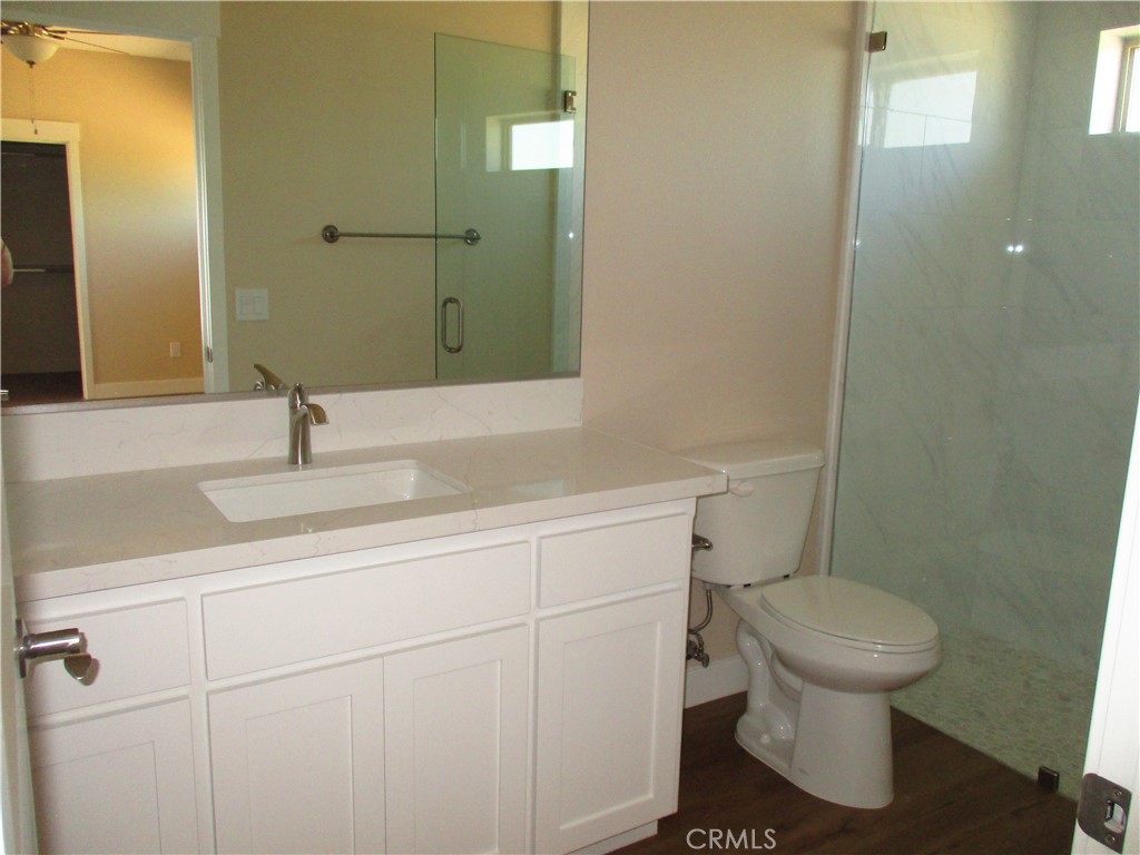 24236 Cahuilla Road Apple Valley, CA 92307 - Photo 24 of 48 a bathroom with a sink toilet and mirror