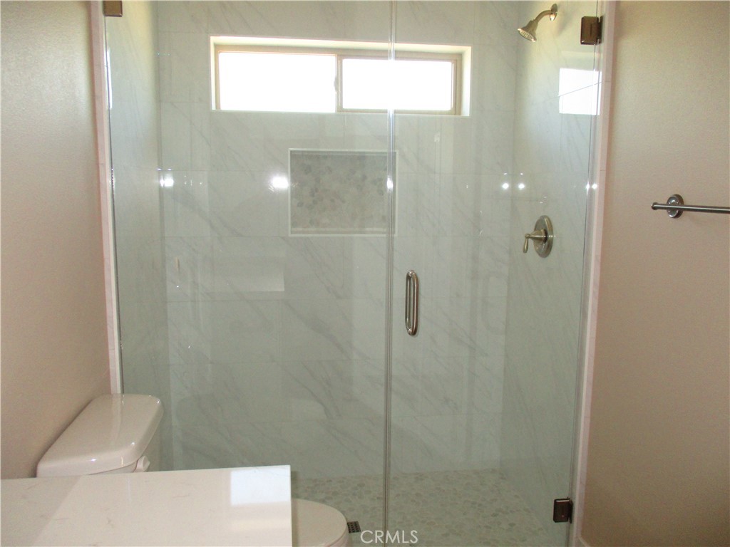 24236 Cahuilla Road Apple Valley, CA 92307 - Photo 25 of 48 a bathroom with a shower