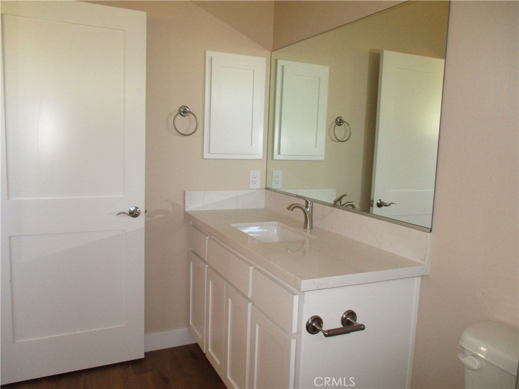 24236 Cahuilla Road Apple Valley, CA 92307 - Photo 26 of 48 a bathroom with a sink and a mirror
