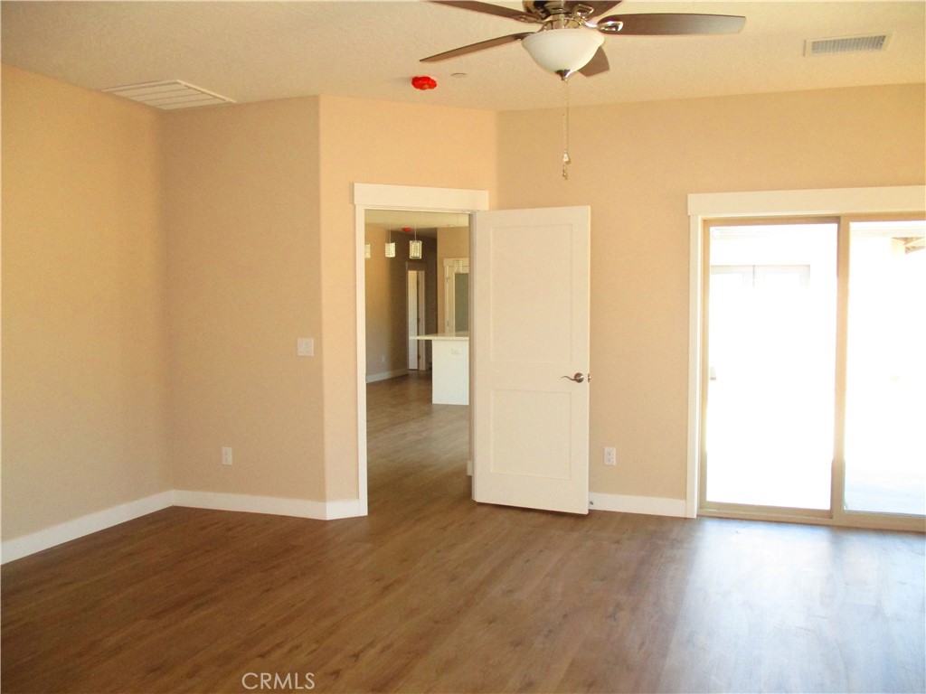 24236 Cahuilla Road Apple Valley, CA 92307 - Photo 32 of 48 wooden floor in an empty room