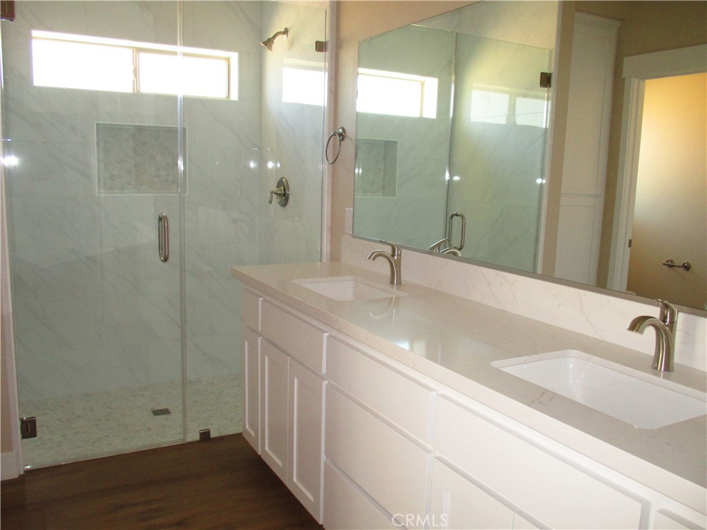 24236 Cahuilla Road Apple Valley, CA 92307 - Photo 33 of 48 a bathroom with a sink and a mirror