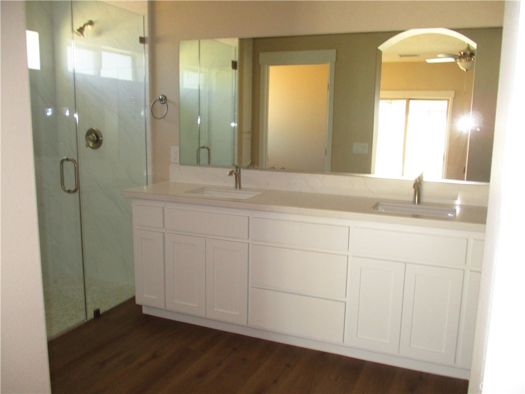 24236 Cahuilla Road Apple Valley, CA 92307 - Photo 34 of 48 a bathroom with a sink and a mirror