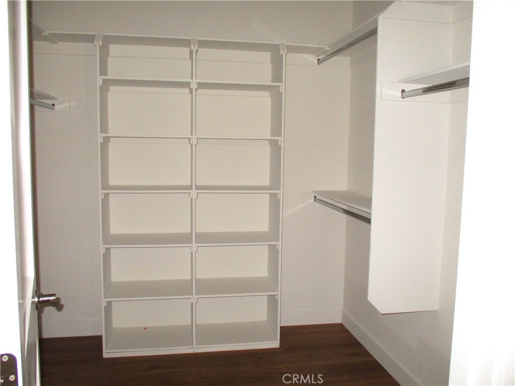 24236 Cahuilla Road Apple Valley, CA 92307 - Photo 35 of 48 a view of walk in closet with empty racks