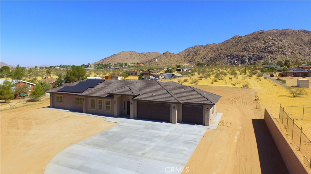 24236 Cahuilla Road Apple Valley, CA 92307 - Photo 41 of 48 a view of a house with a ocean view