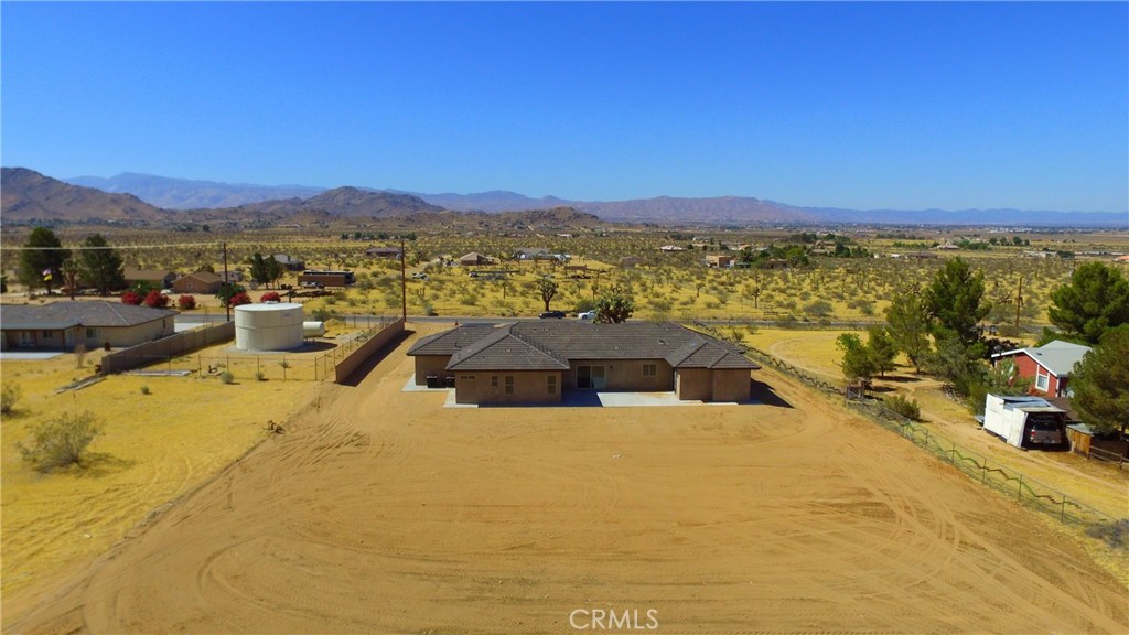 24236 Cahuilla Road Apple Valley, CA 92307 - Photo 42 of 48 a view of a swimming pool with an ocean view