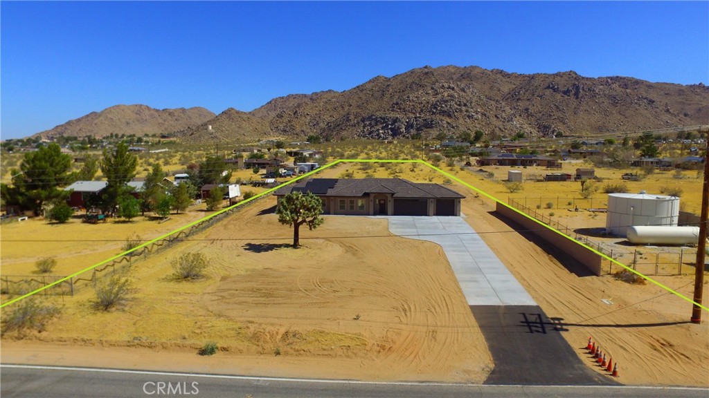 24236 Cahuilla Road Apple Valley, CA 92307 - Photo 47 of 48 a view of a swimming pool with mountains in the background