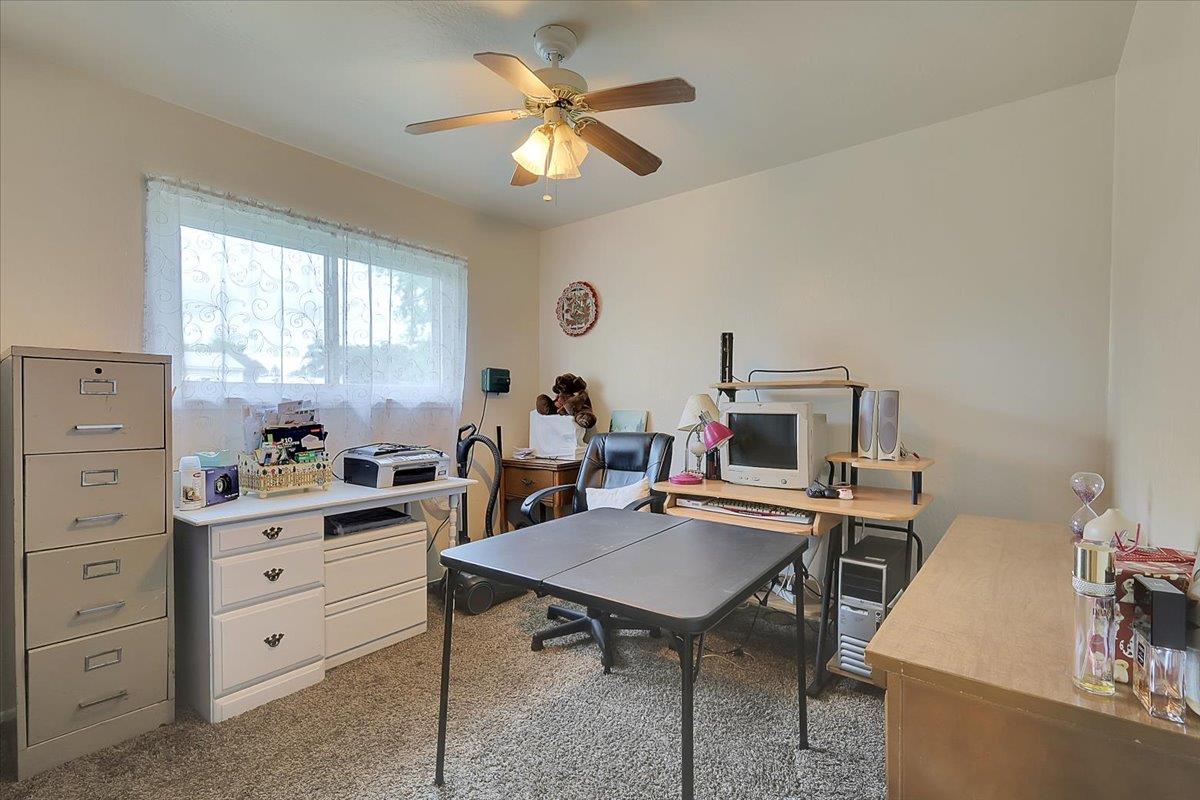 1650 North Township Road Yuba City, CA 95993 - Photo 14 of 27 a view of a workspace with furniture and a window