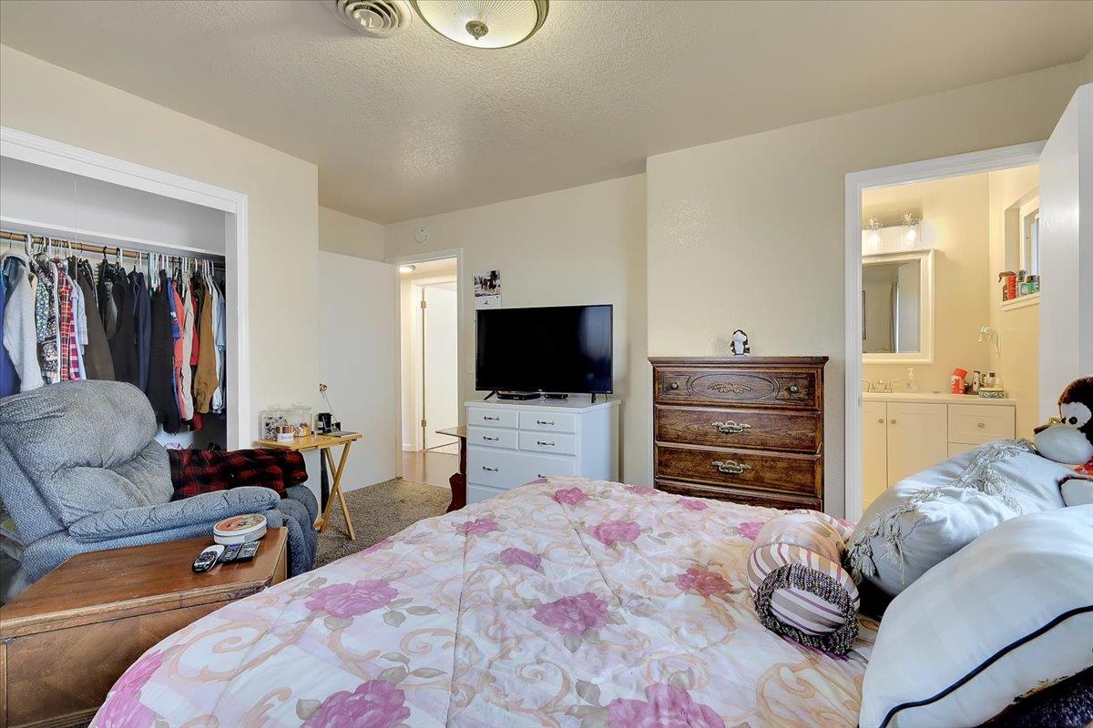 1650 North Township Road Yuba City, CA 95993 - Photo 16 of 27 a bedroom with furniture and a flat screen tv