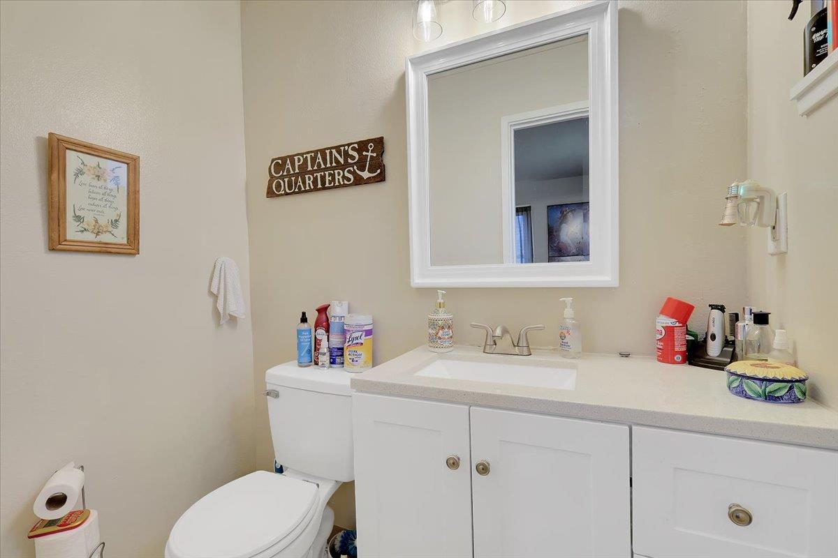 1650 North Township Road Yuba City, CA 95993 - Photo 17 of 27 a bathroom with a sink mirror vanity and toilet