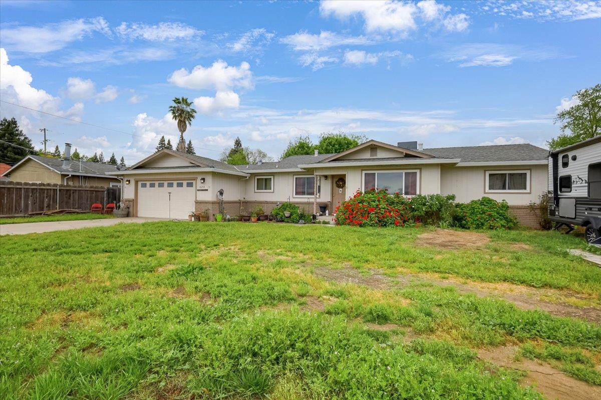1650 North Township Road Yuba City, CA 95993 - Photo 2 of 27 a view of a house with a yard