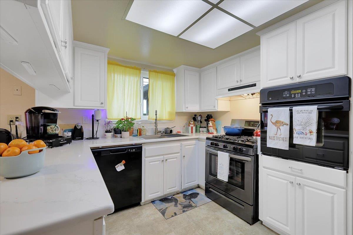 1650 North Township Road Yuba City, CA 95993 - Photo 4 of 27 a kitchen with a sink stove and cabinets