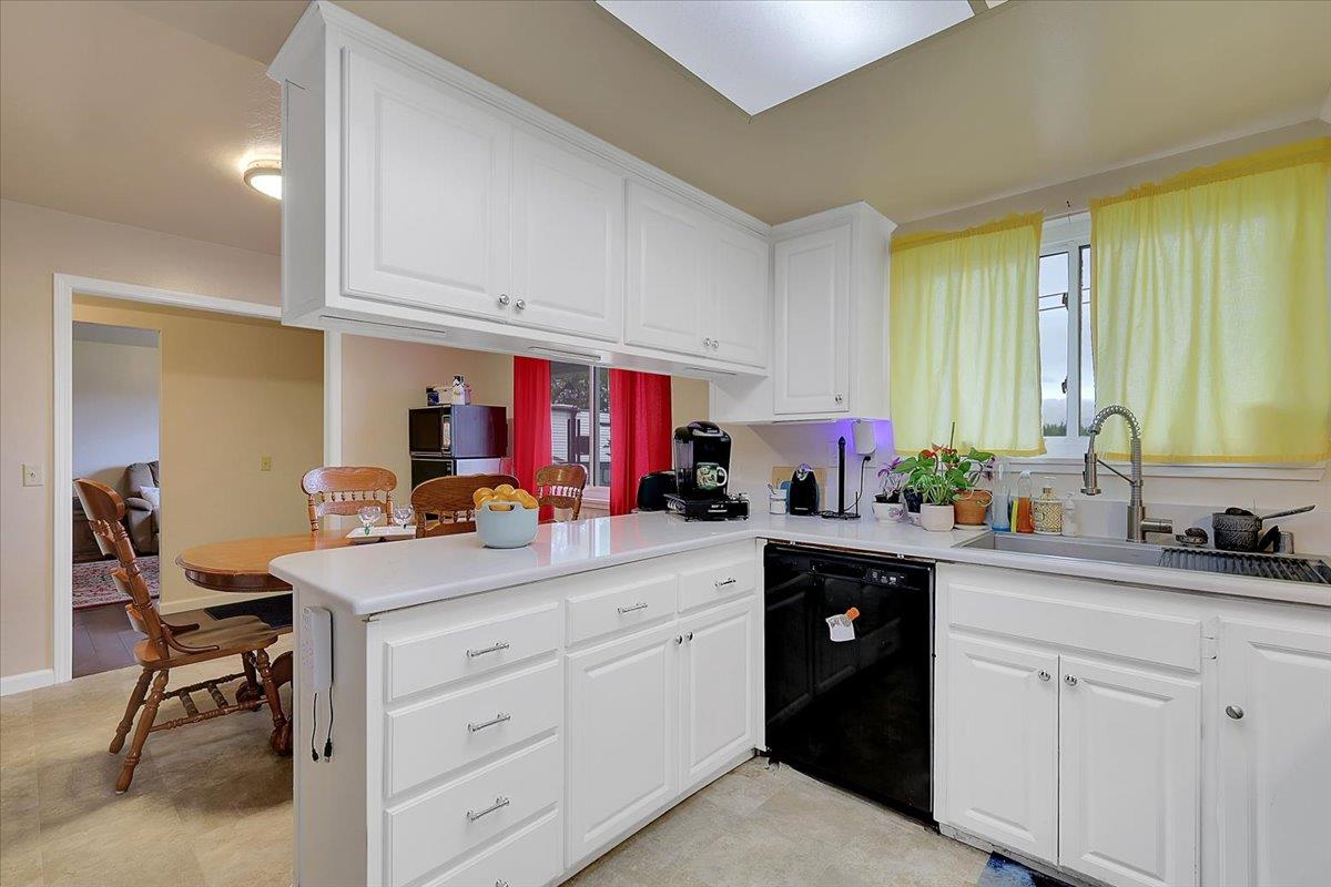 1650 North Township Road Yuba City, CA 95993 - Photo 5 of 27 a kitchen with a sink and cabinets