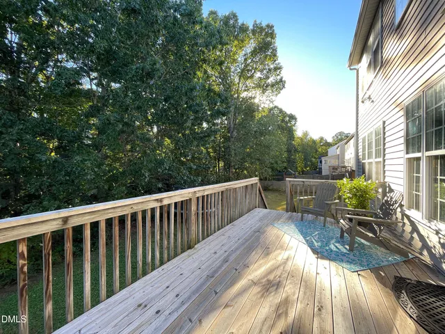 a view of balcony with furniture and wooden deck