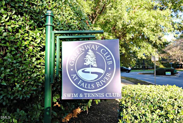 a sign that is on a brick wall