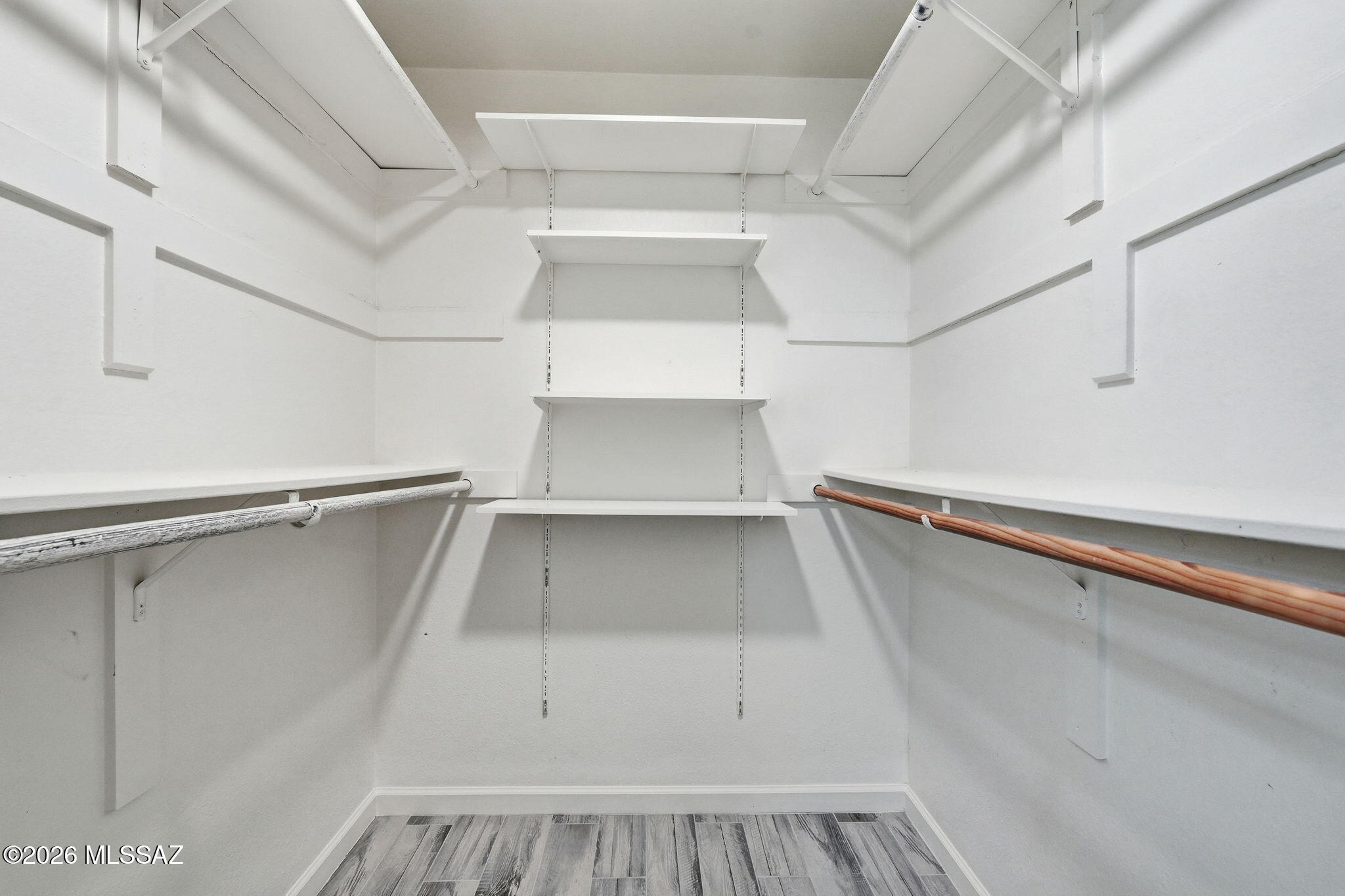 1183 Circulo Canario Rio Rico, AZ 85648 - Photo 14 of 31 a view of walk in closet with empty racks