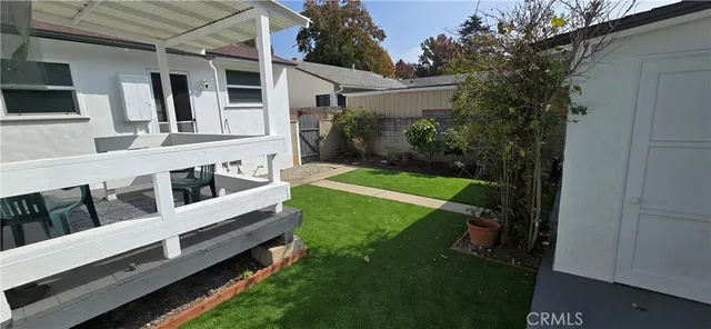 a view of backyard with deck