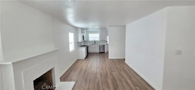 a view of a room with wooden floor and staircase