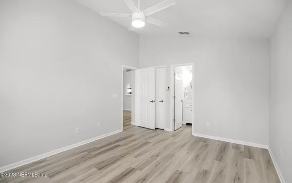 a bathroom with a sink a mirror and a shower