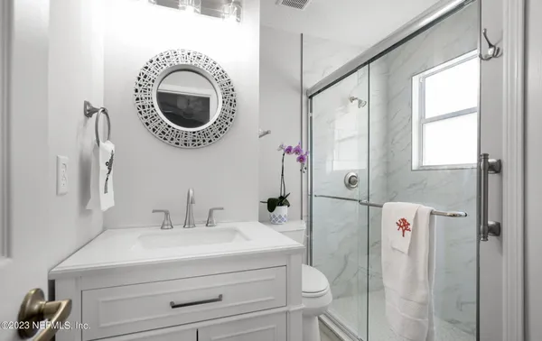 a bathroom with a shower curtain